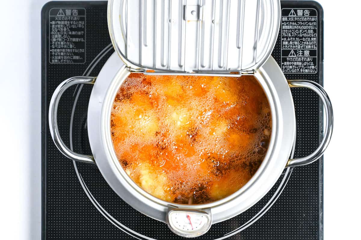 frying lemon chicken karaage in oil at lower temperature