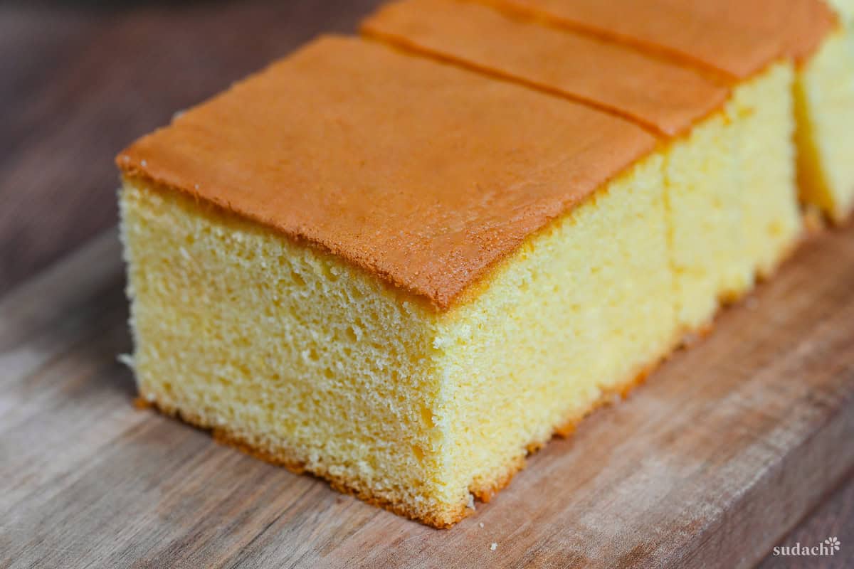 Japanese castella cake on a wooden chopping board