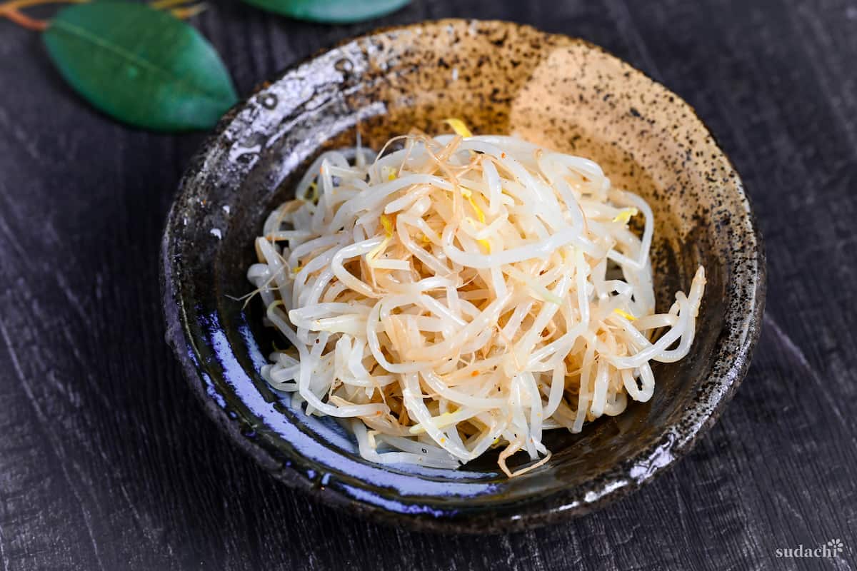 Seasoned Bean Sprouts for ramen in a black and beige Japanese-style bowl