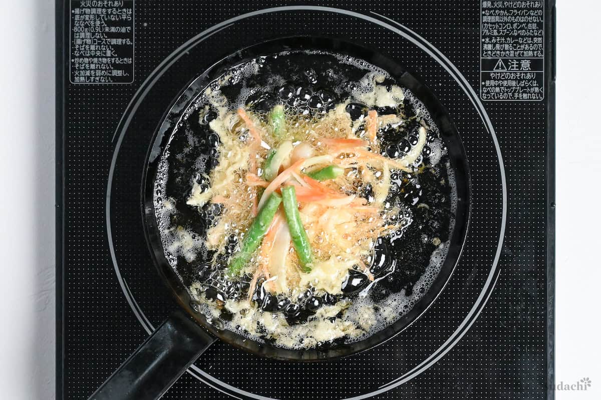 kakiage shallow frying in a small pan