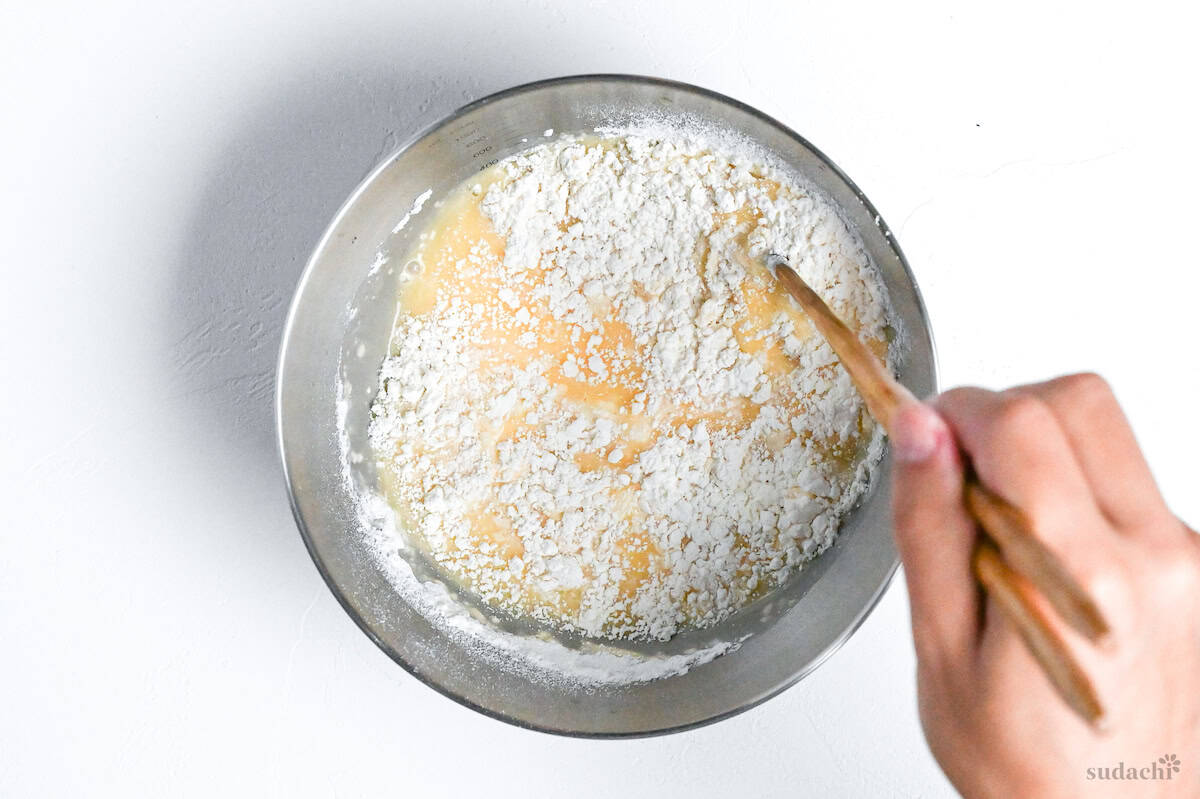 mixing flour into tempura batter by drawing crosses with chopsticks to avoid overmixing