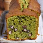 Matcha and adzuki bean poundcake on a cream colored rectangular plate on wooden background