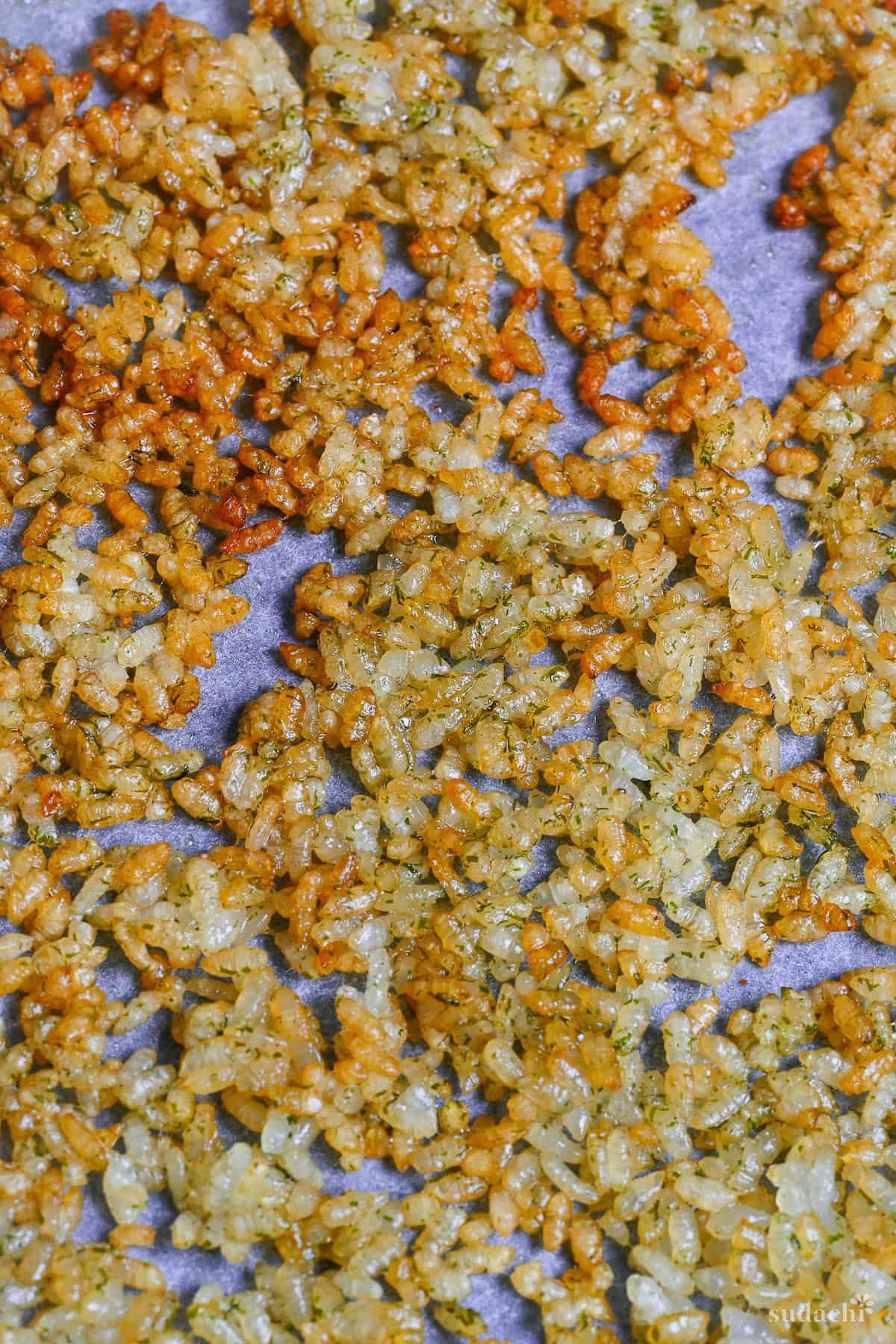 Crispy rice after oven baking on a baking tray