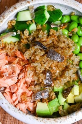 Japanese style crispy rice salad in a mottled bowl top down view