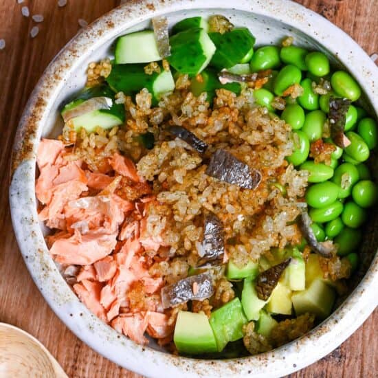 Japanese style crispy rice salad in a mottled bowl top down view