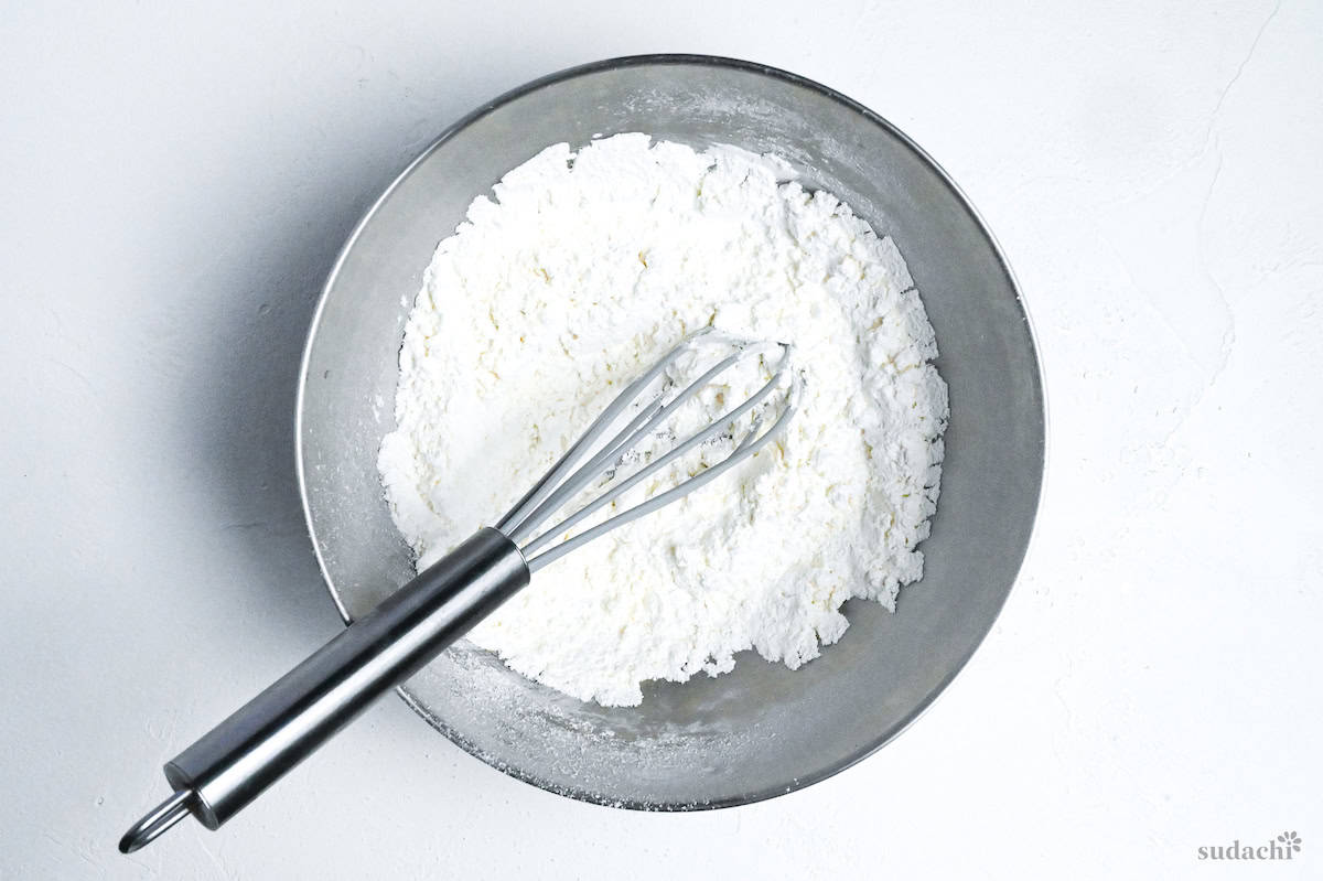 whisked dry ingredients for mushi pan in a steel mixing bowl