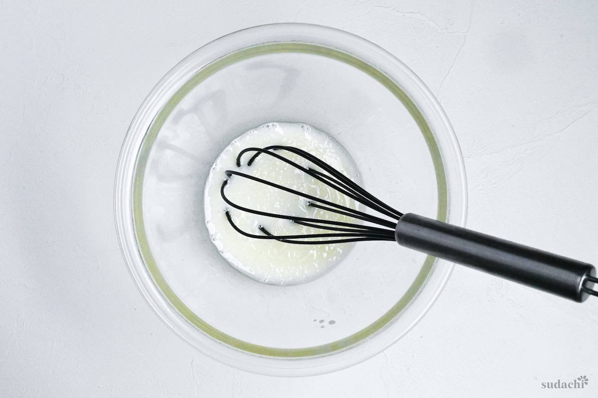 wet ingredients for mushi pan mixed in a glass mixing bowl