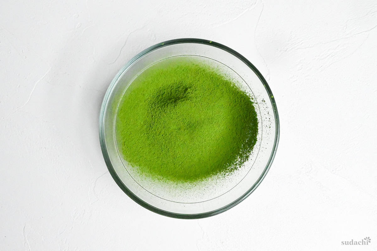 matcha powder sifted into a bowl