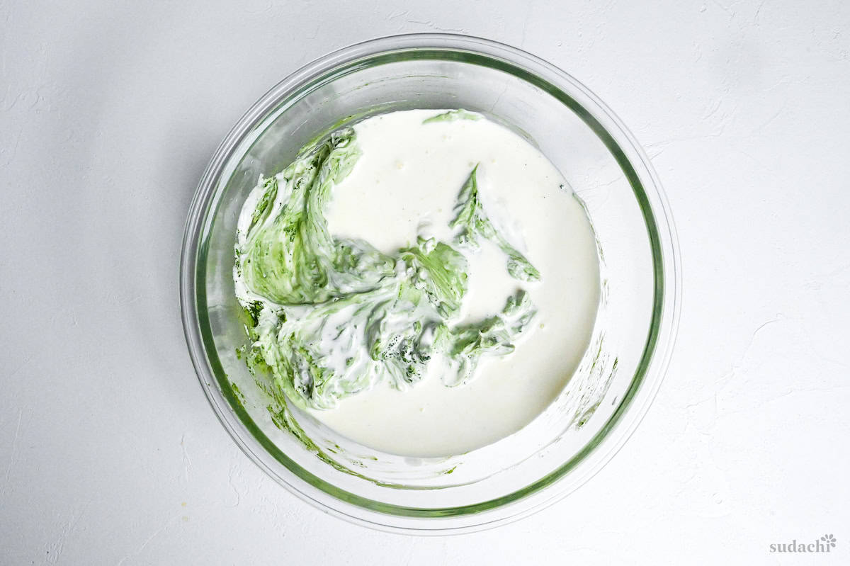 heavy cream in bowl with matcha and mascarpone cheese