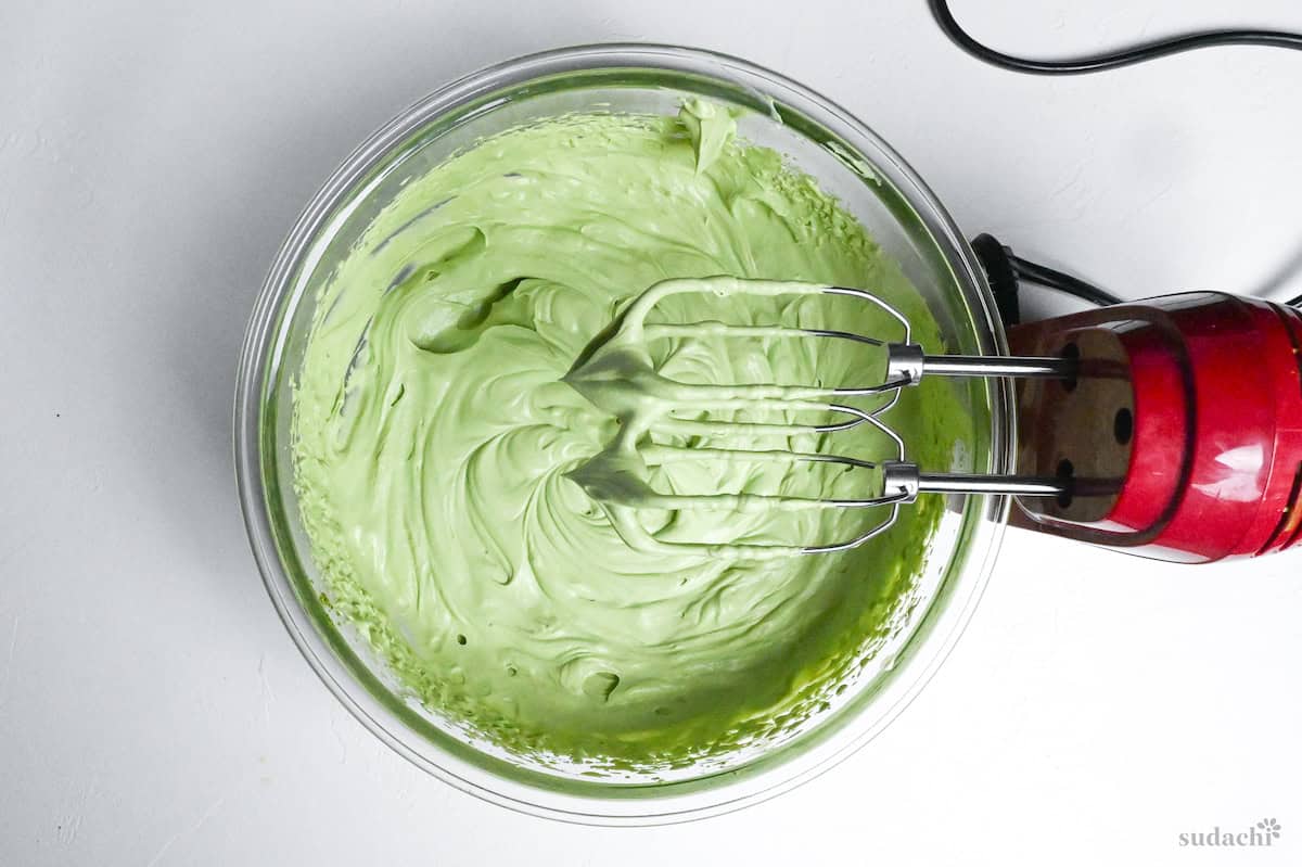 whipped matcha mascarpone cream in a glass bowl