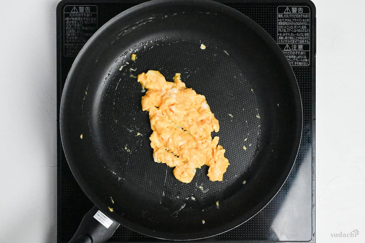 scrambled egg in a frying pan on the stove