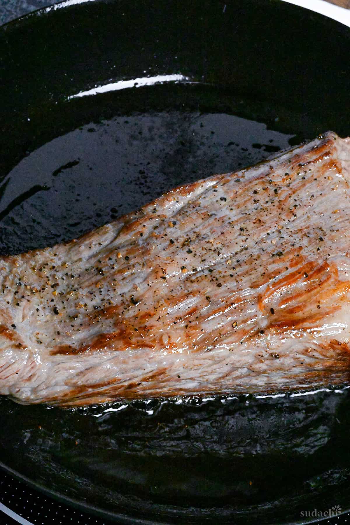 Japanese-style roast beef in a frying pan on the stove