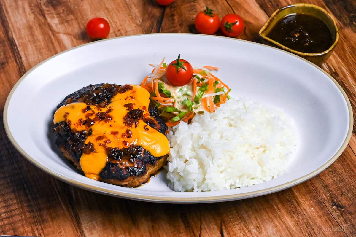 Bikkuri Donkey Copycat Hamburg on a white plate with rice and salad