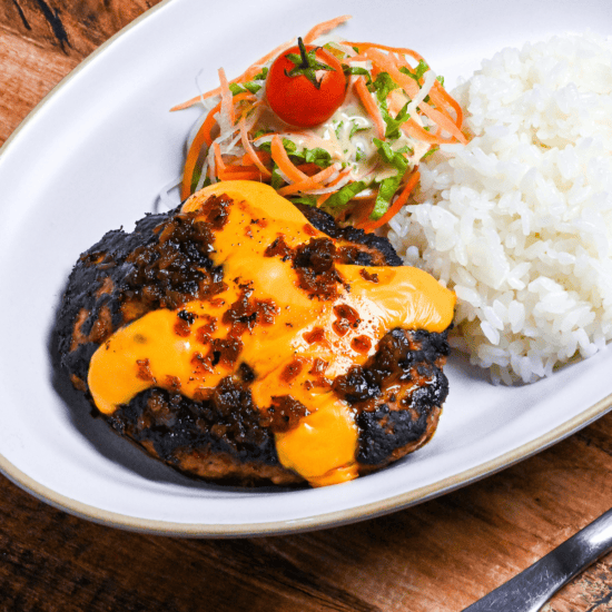 Bikkuri Donkey Copycat Hamburg on a white plate with rice and salad