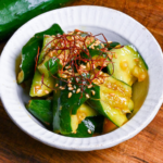 Close up of Japanese smashed cucumber (tataki kyuri) coated in spicy miso sauce