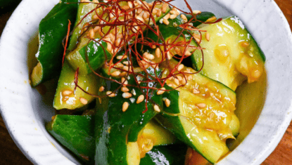 Close up of Japanese smashed cucumber (tataki kyuri) coated in spicy miso sauce