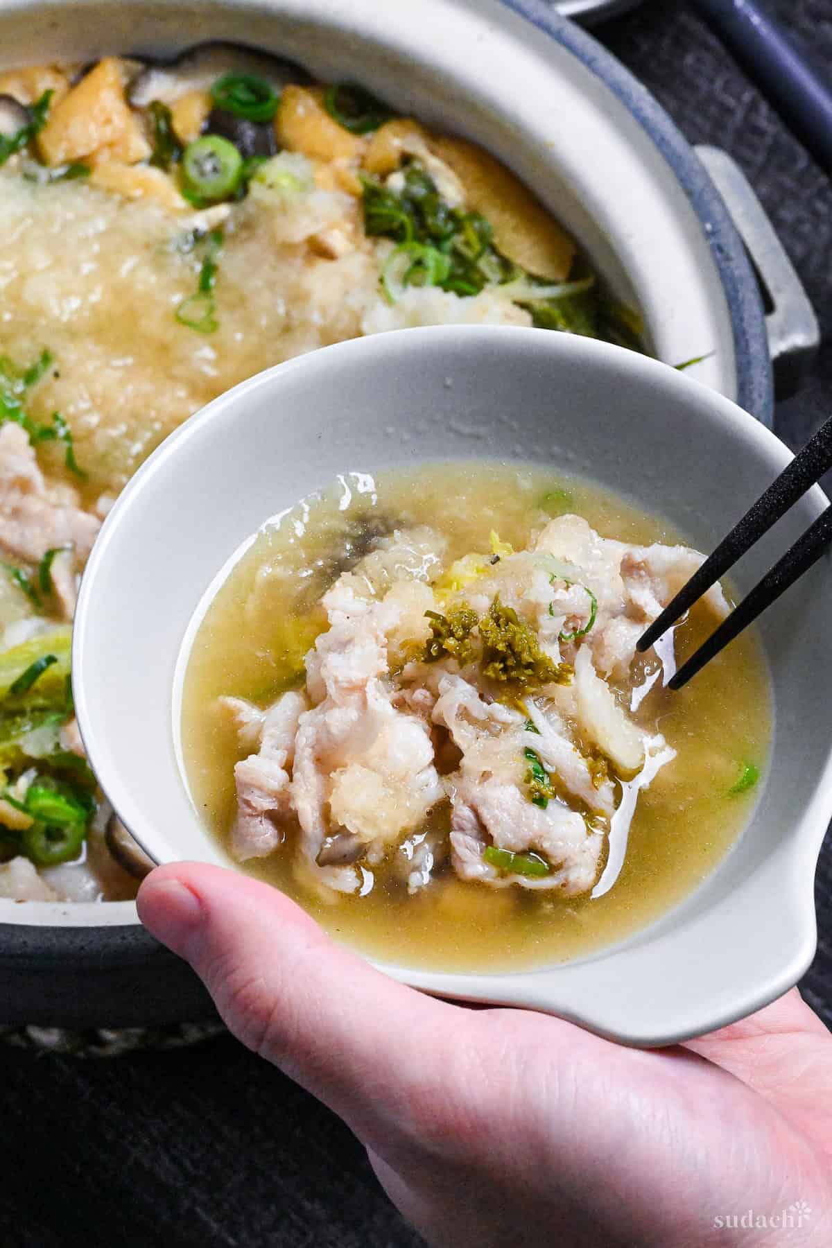 Daikon radish hot pot in a small bowl with yuzu kosho on top