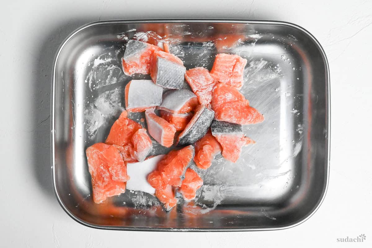 pieces of salmon coated with a thin layer of starch