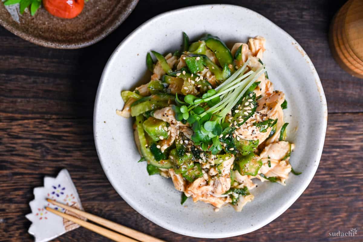 Poached Chicken Tender Salad with Fruity Japanese Style Dressing in a white dish top down landscape
