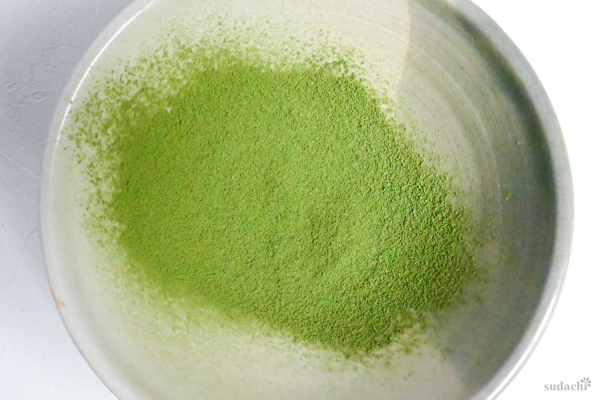 sifted matcha in a ceramic bowl