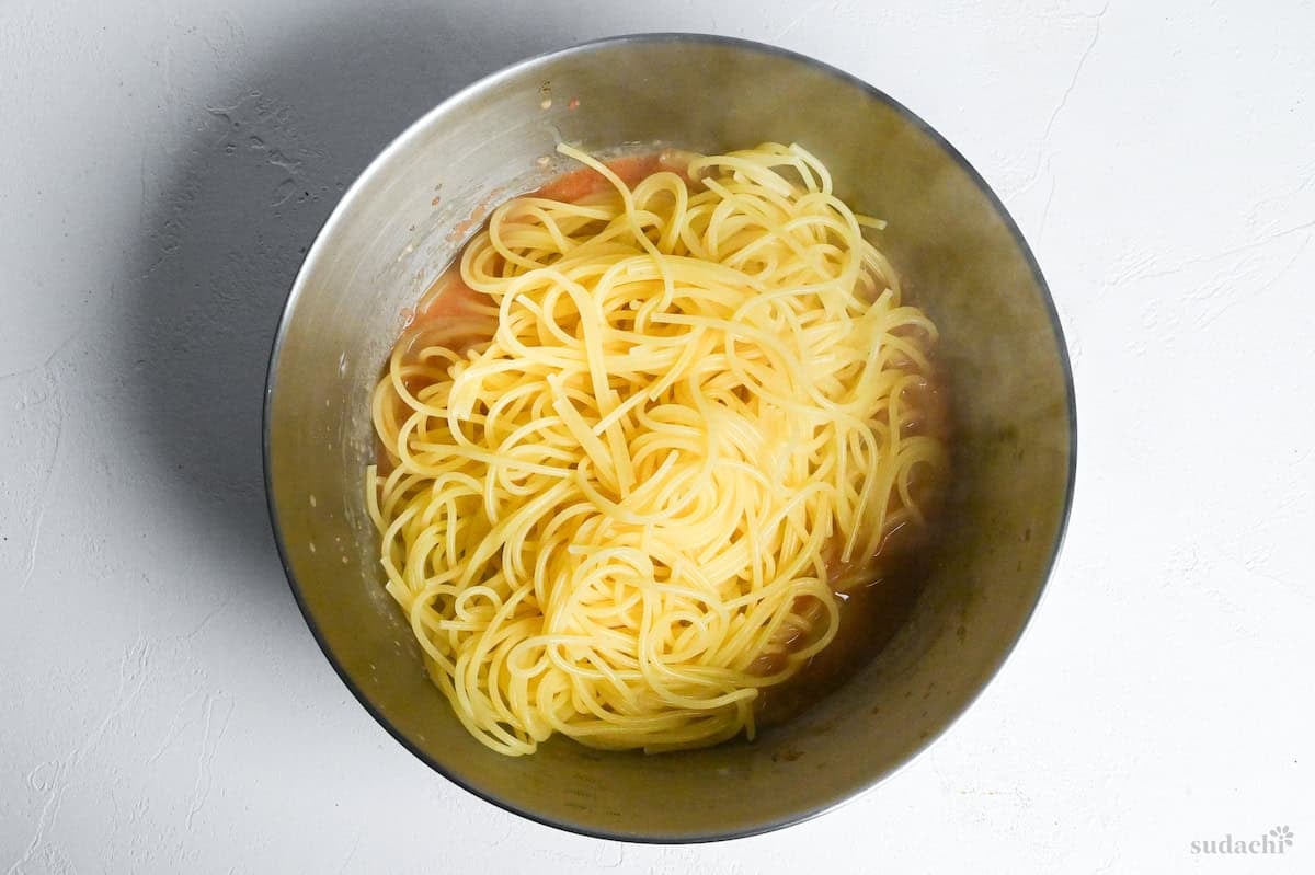 freshly cooked spaghetti in a bowl with mentaiko sauce for Japanese wafu mentaiko pasta