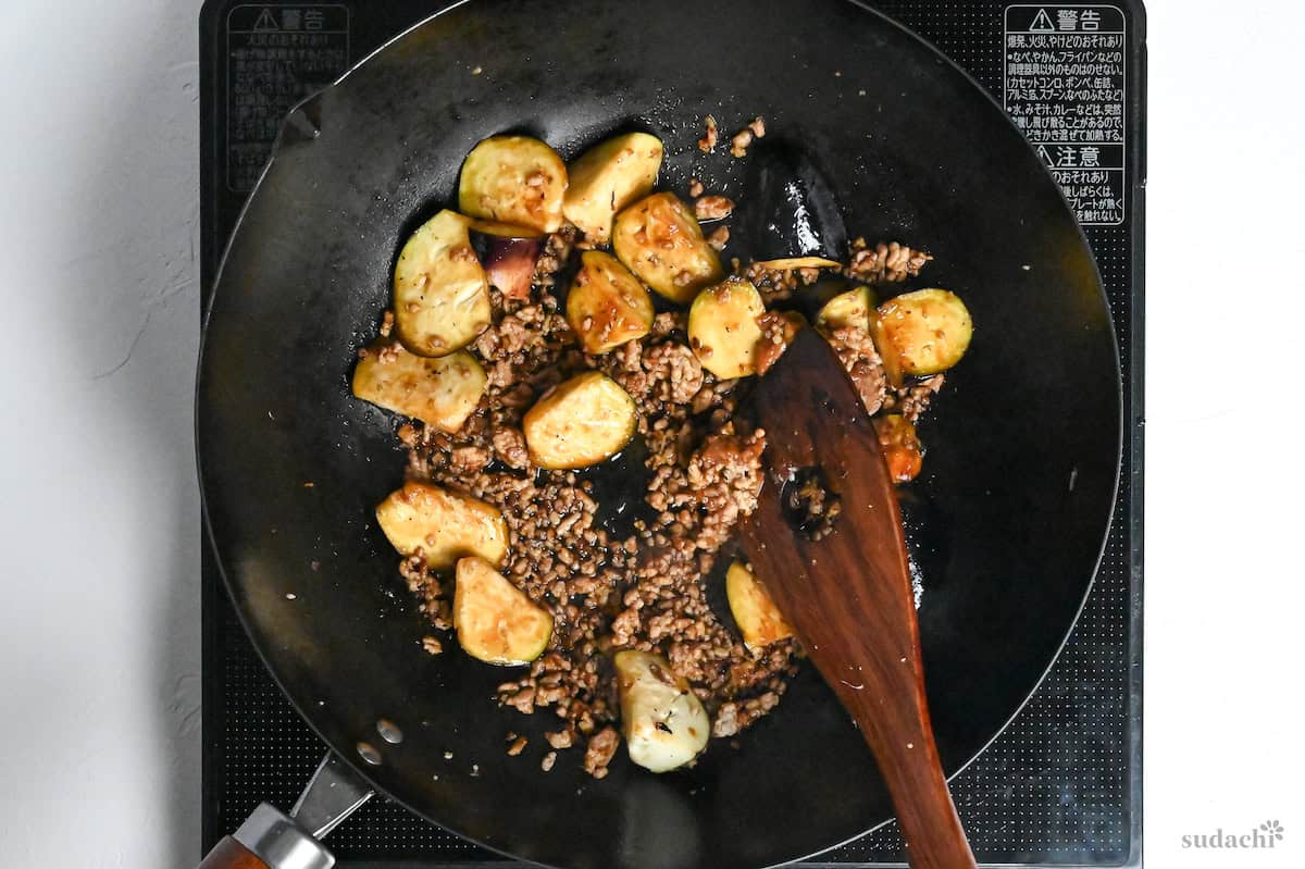 ground pork and eggplant in a Japanese style sauce cooking in a wok
