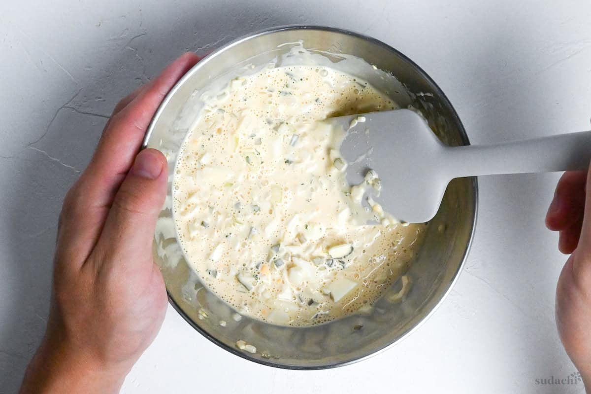 mixed tartar sauce in a steel mixing bowl