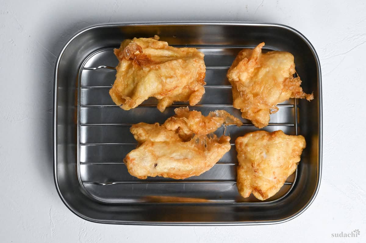 battered chicken on a wire rack