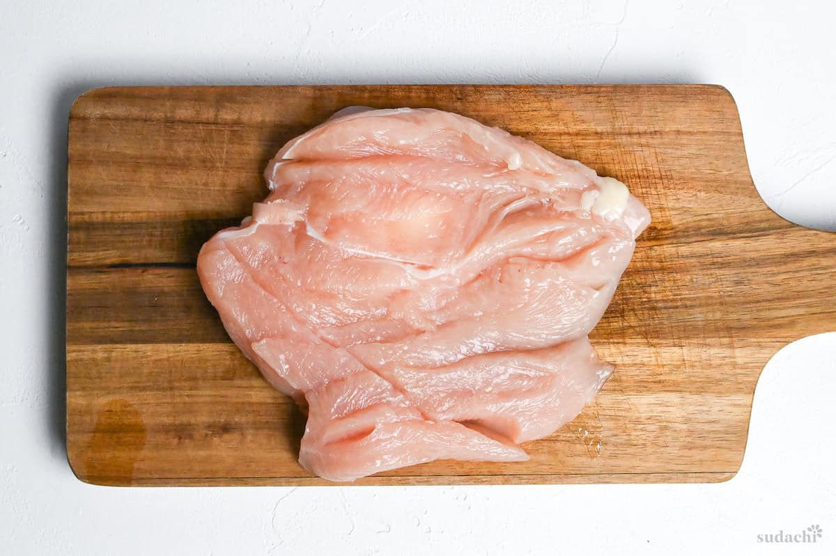 butterflied chicken breast on a cutting board