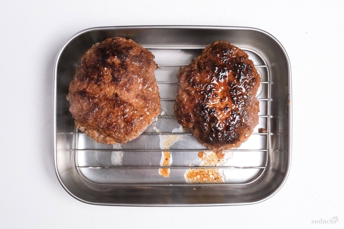 fried hamburg patties resting on a wire rack