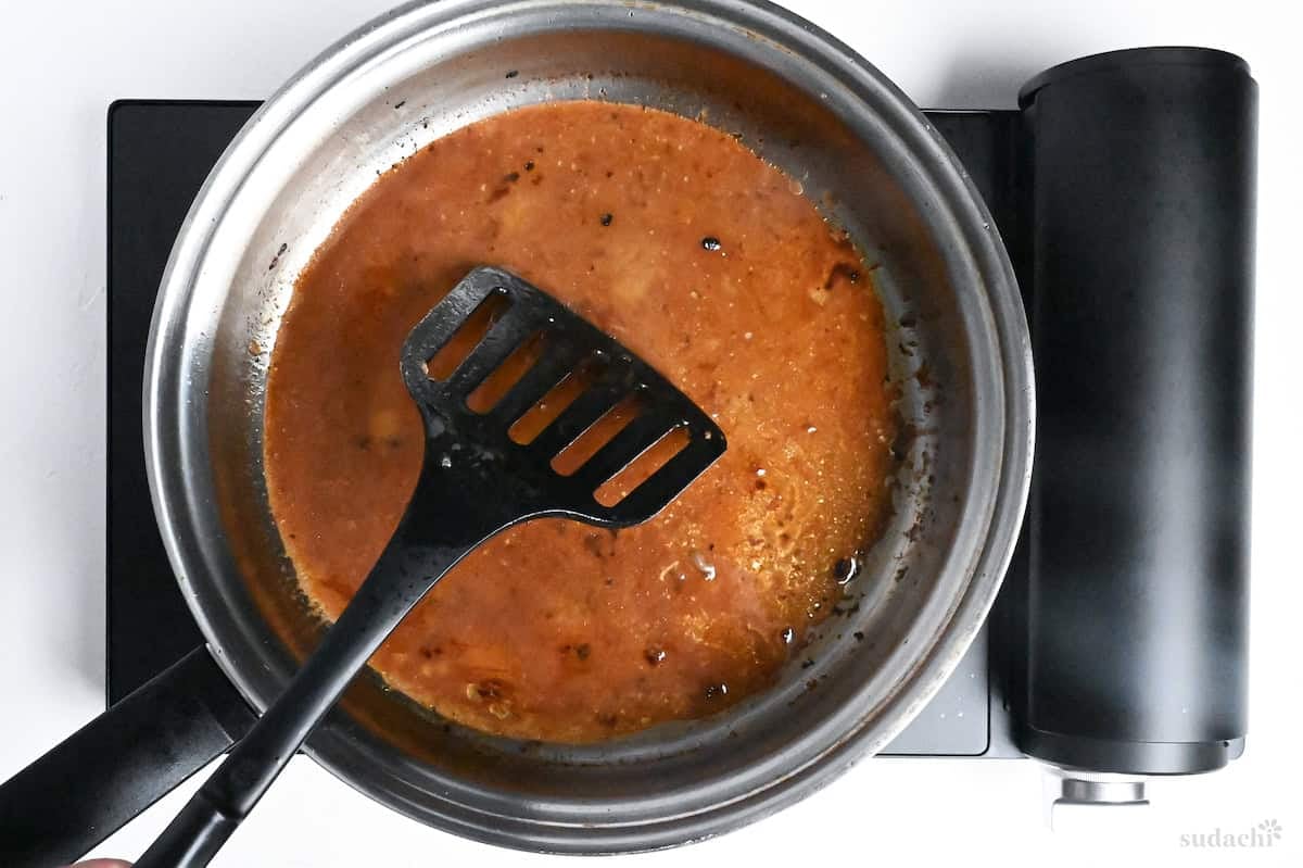 deglazing stainless steel pan with red wine