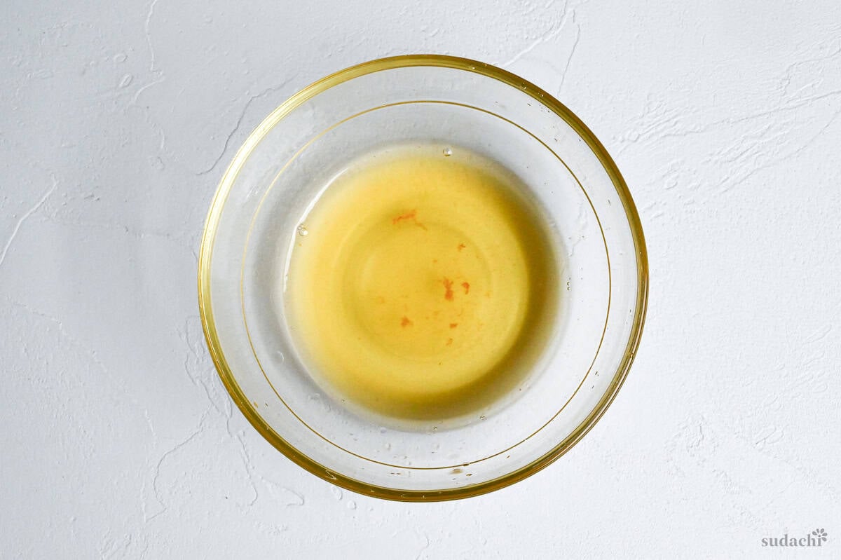rendered chicken fat/juices in a glass bowl