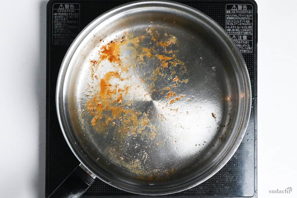 stainless steel pan after frying chicken thigh