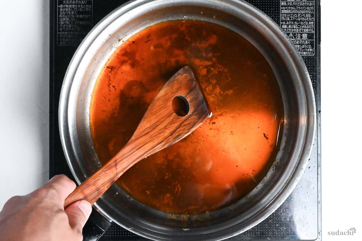 deglazing stainless steel pan with teriyaki sauce