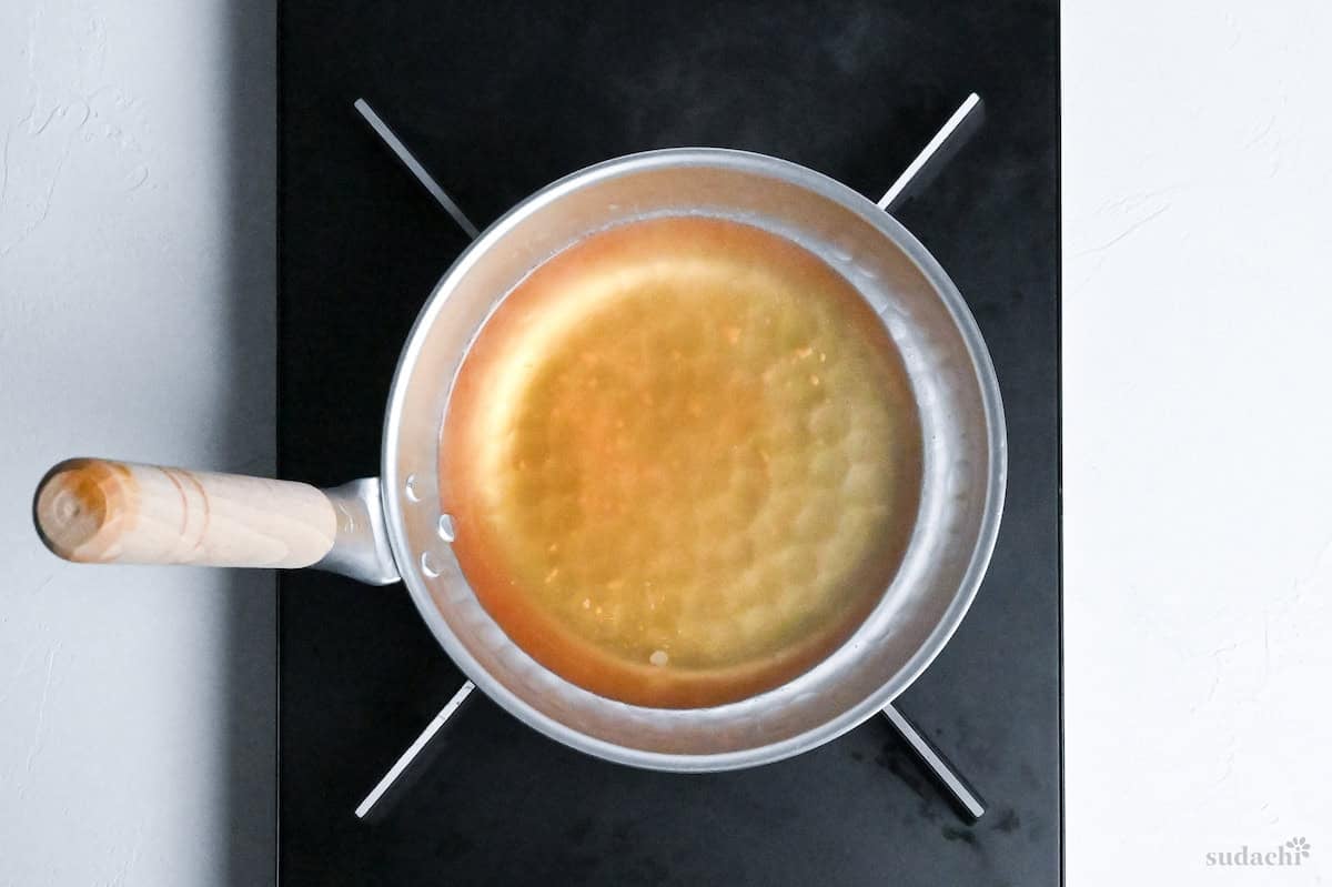 dashi and condiments in a pan to make katsudon