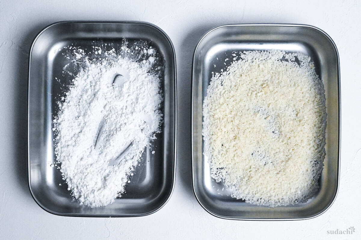 starch and panko breadcrumbs in separate trays for coating chicken katsu