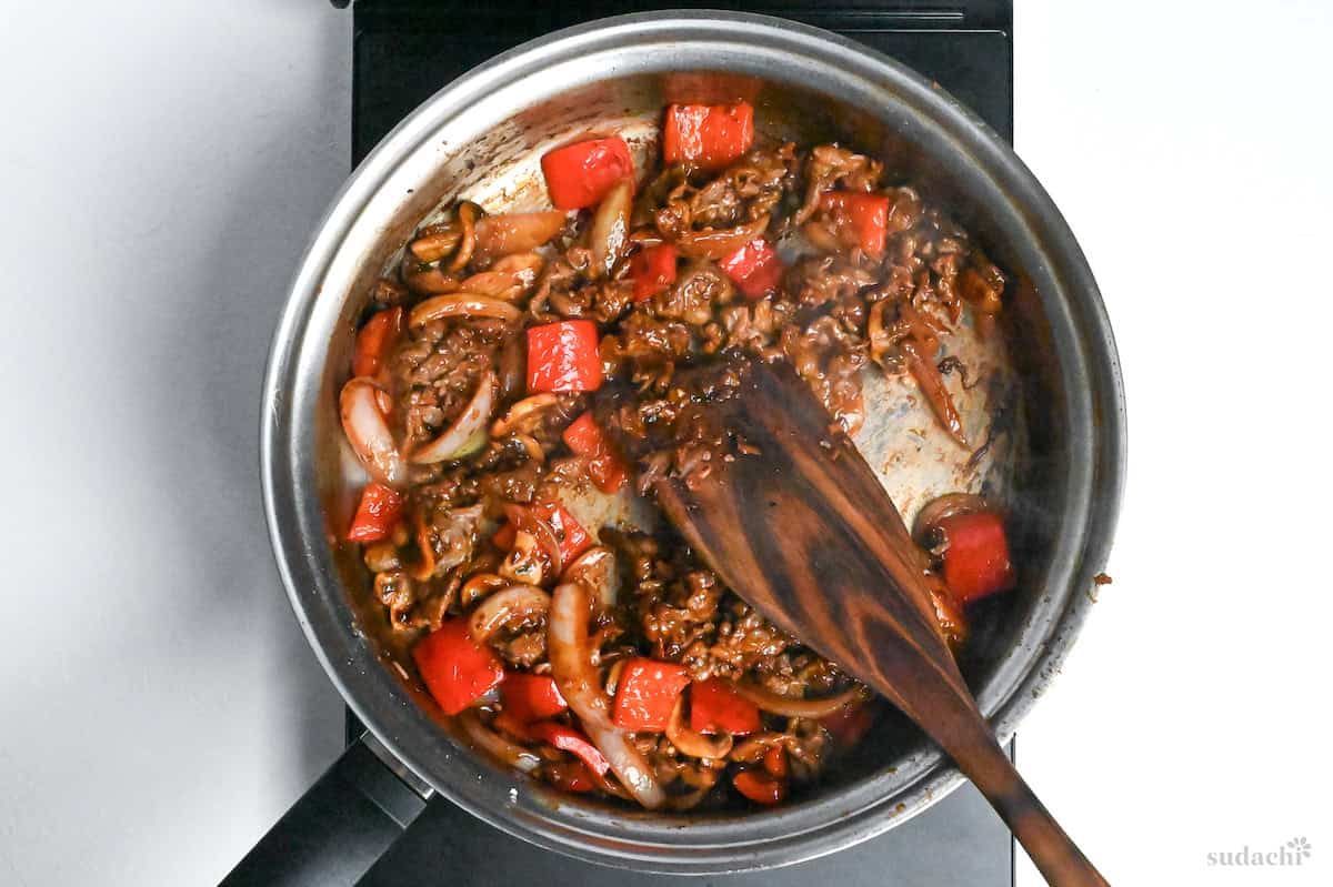 beef and vegetables coated with ketchup