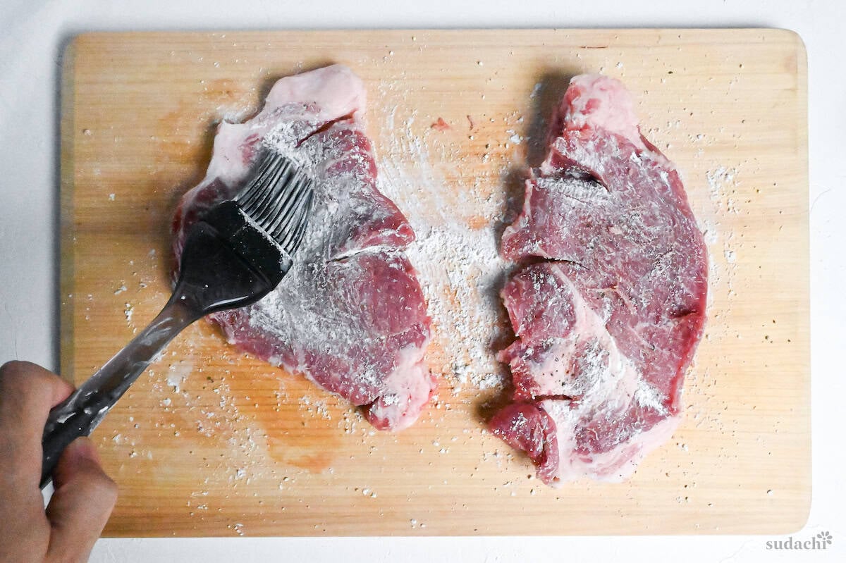 Pork shoulder steaks brushed with starch