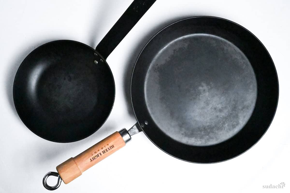 two pans on a white background