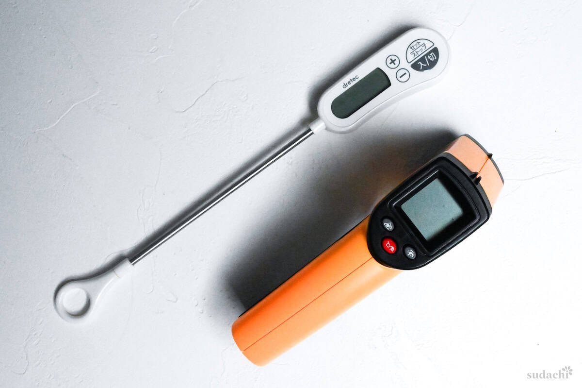 two digital thermometers on a white background