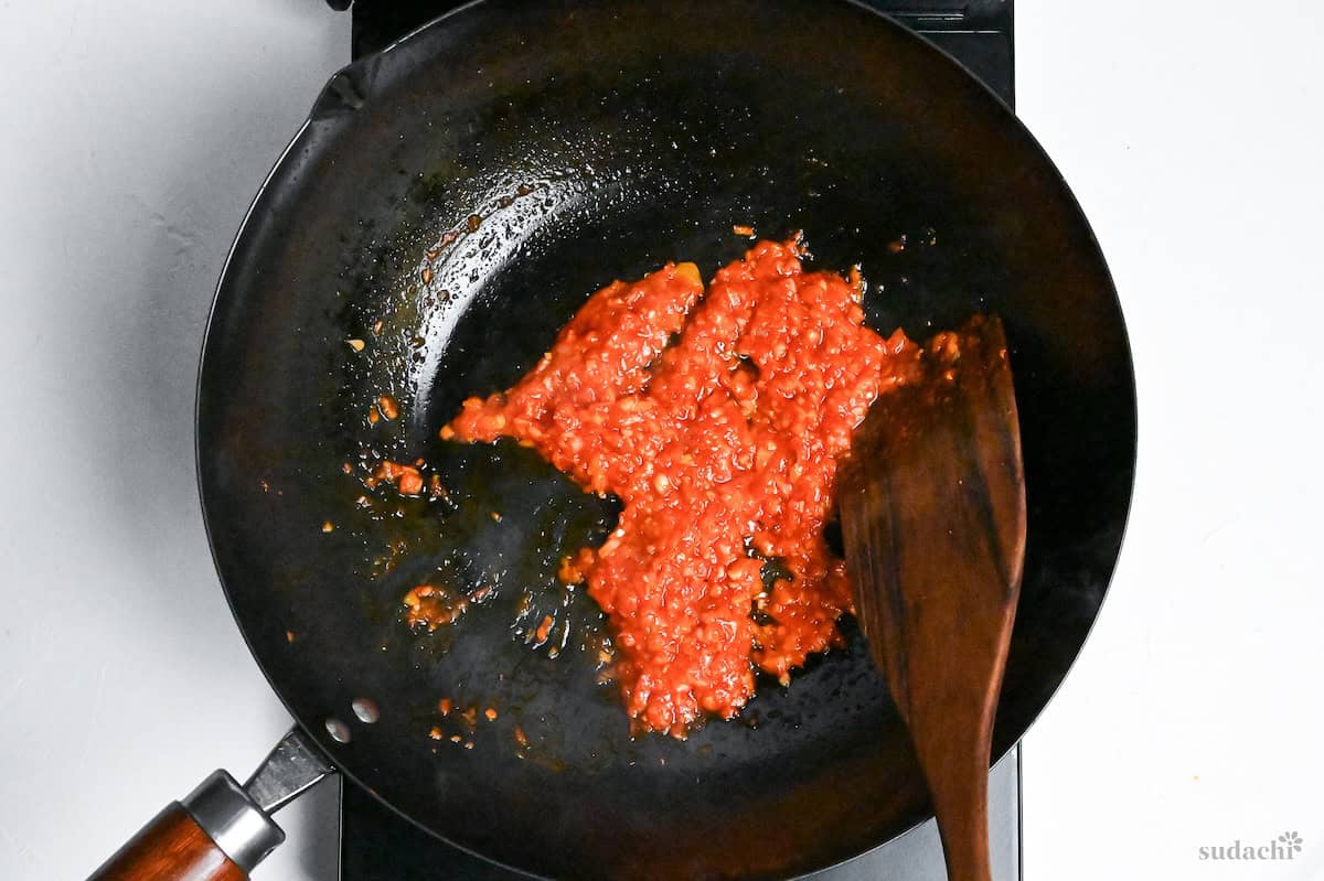 ebi chili sauce base cooking in a wok on the stove top