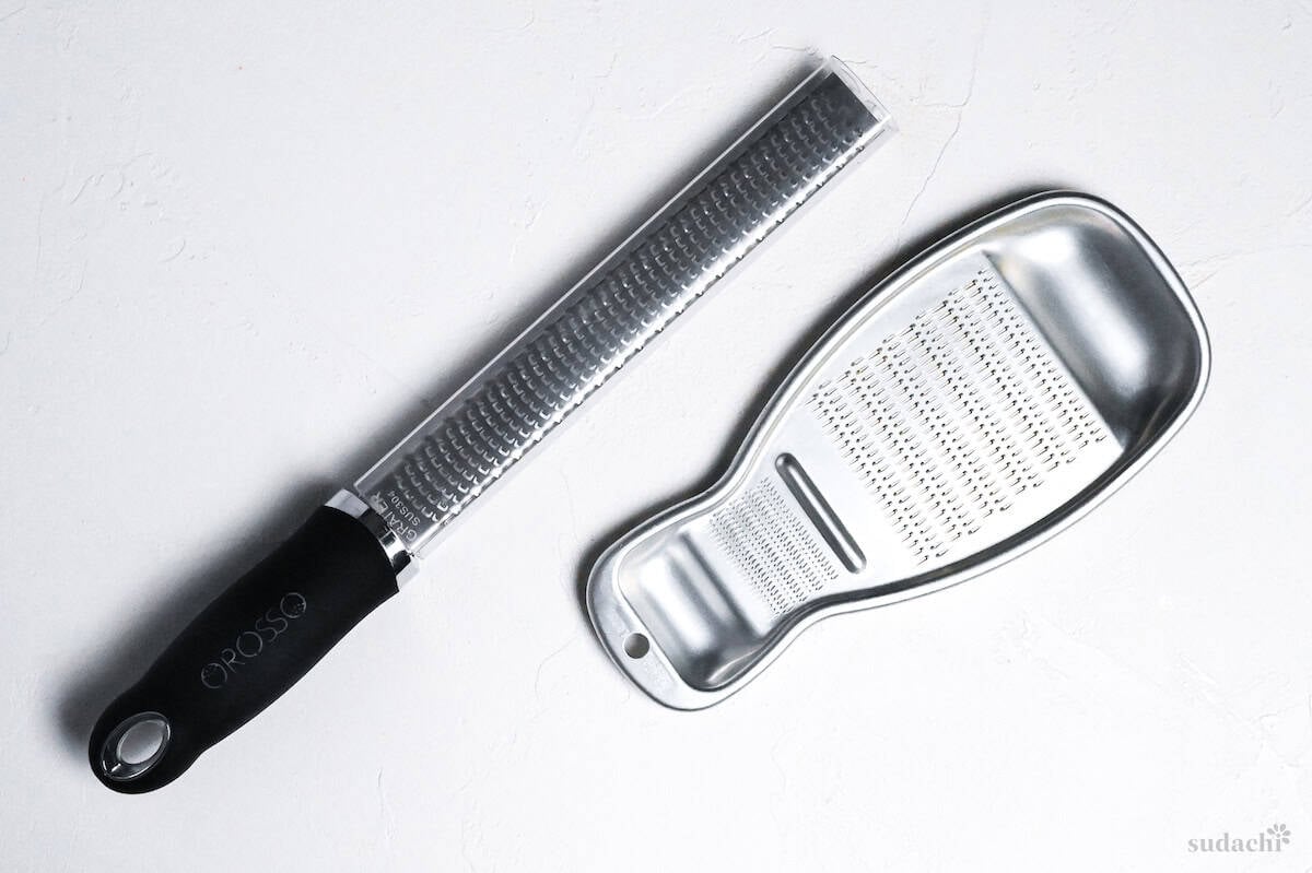 Microplane grater and oroshi grater on a white background