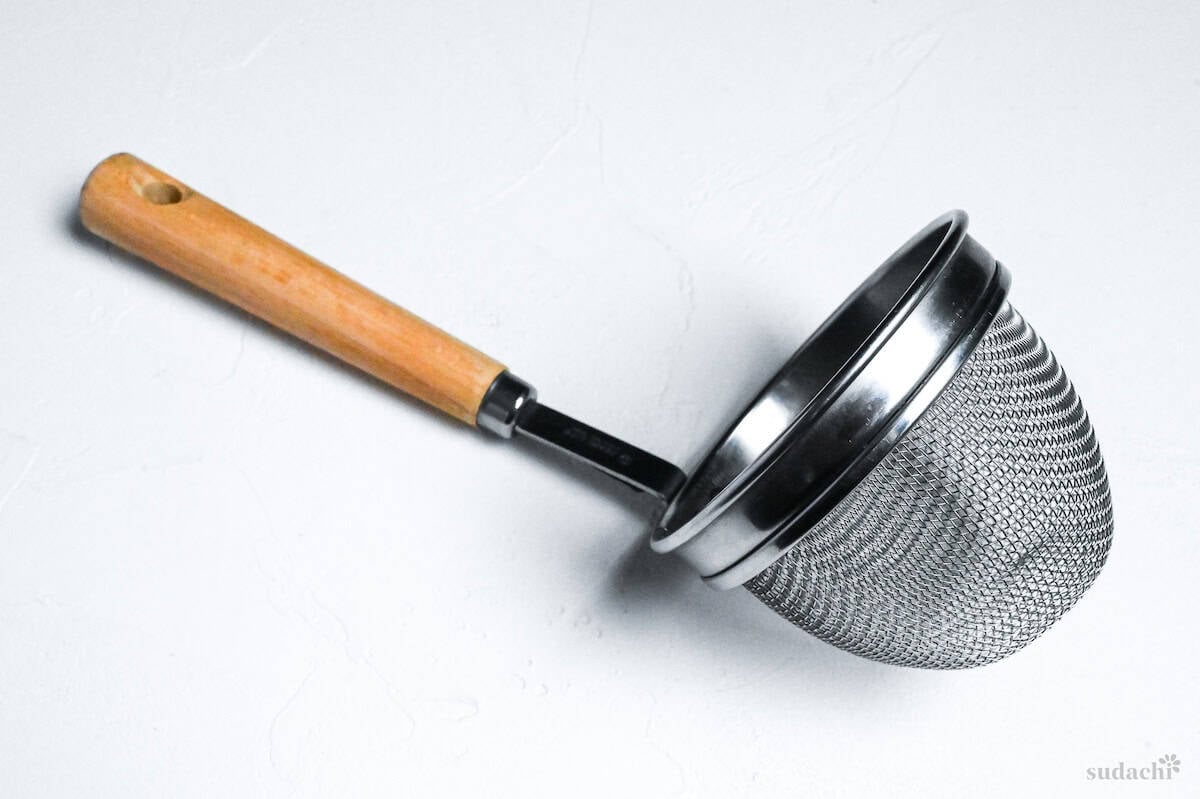 miso strainer on a white background