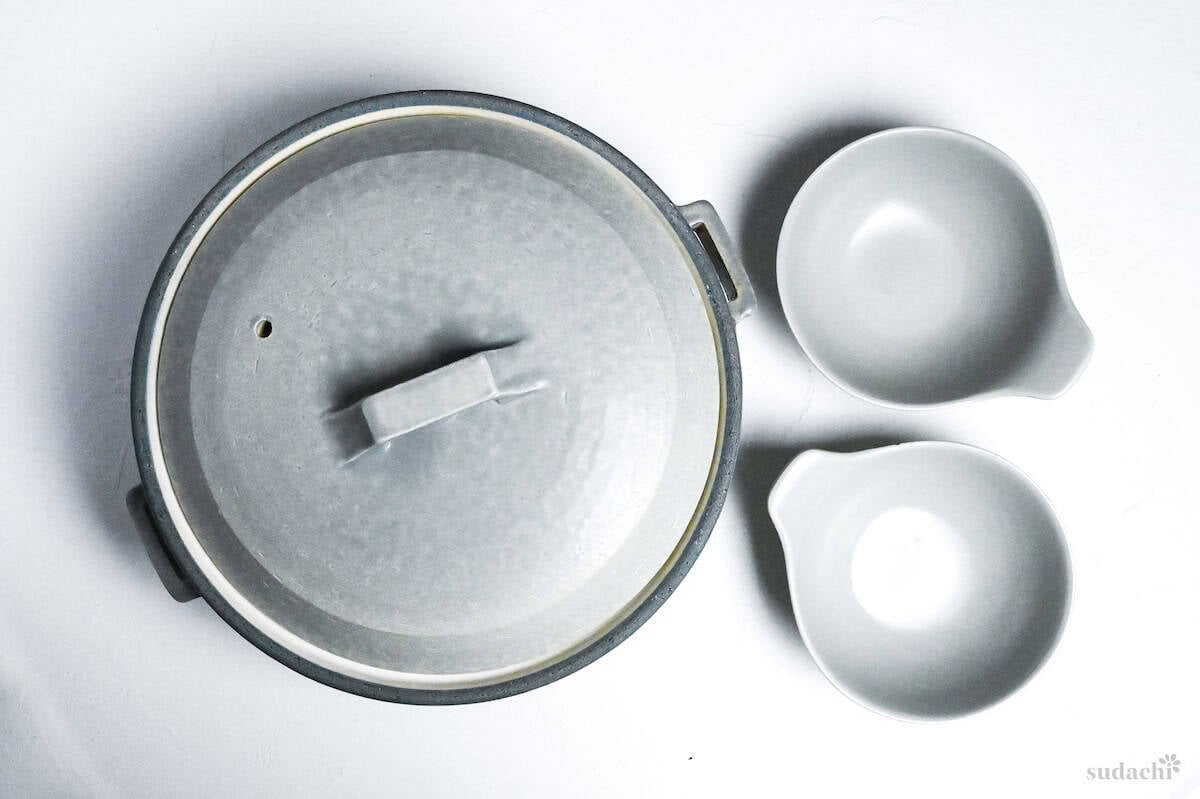 ceramic nabe pot (gray) and two serving bowls on a white background