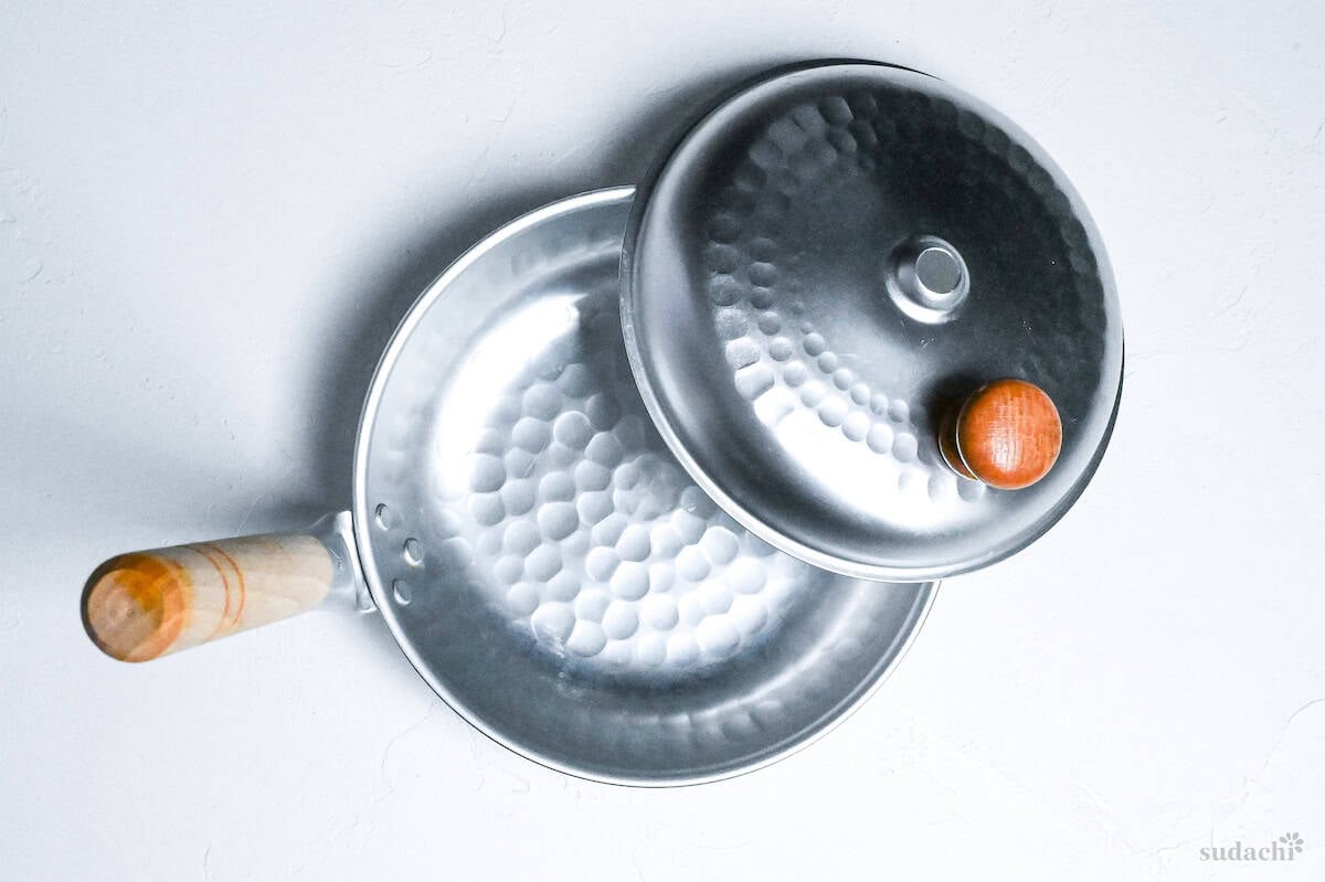 Oyakodon pan with lid on a white background