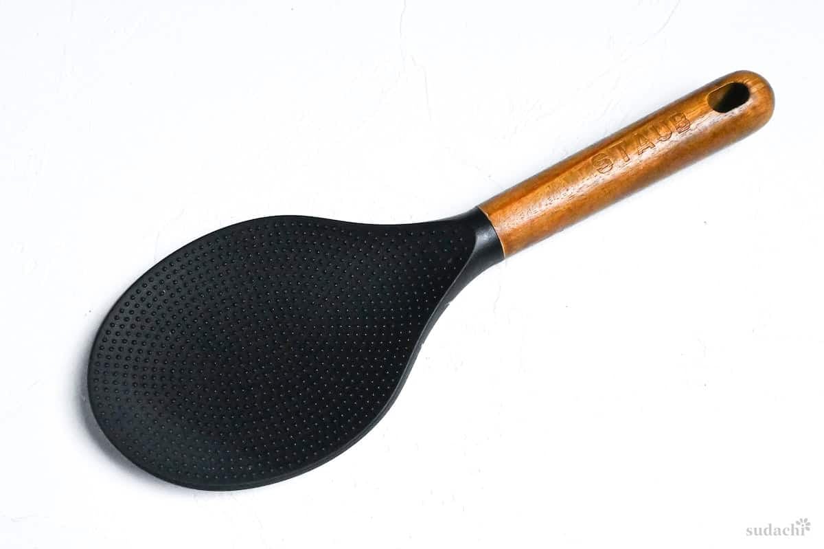 silicone rice paddle with wooden handle on a white background