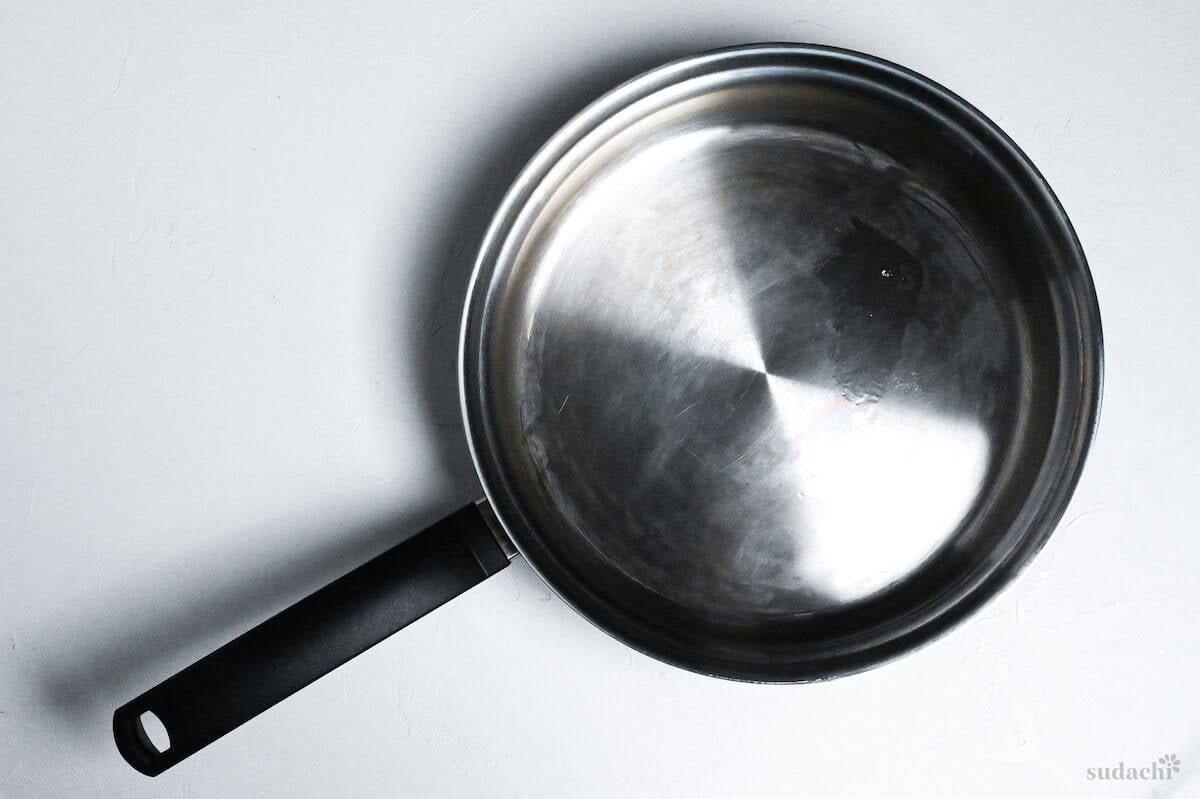 stainless steel pan on a white background