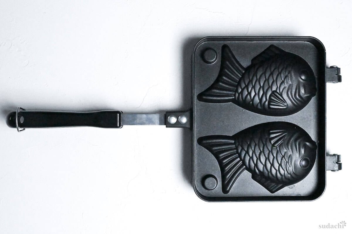 taiyaki mold with long handle for gas stove on a white background