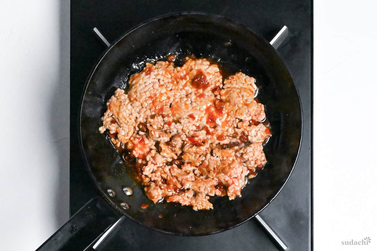 Ground pork frying in a pan