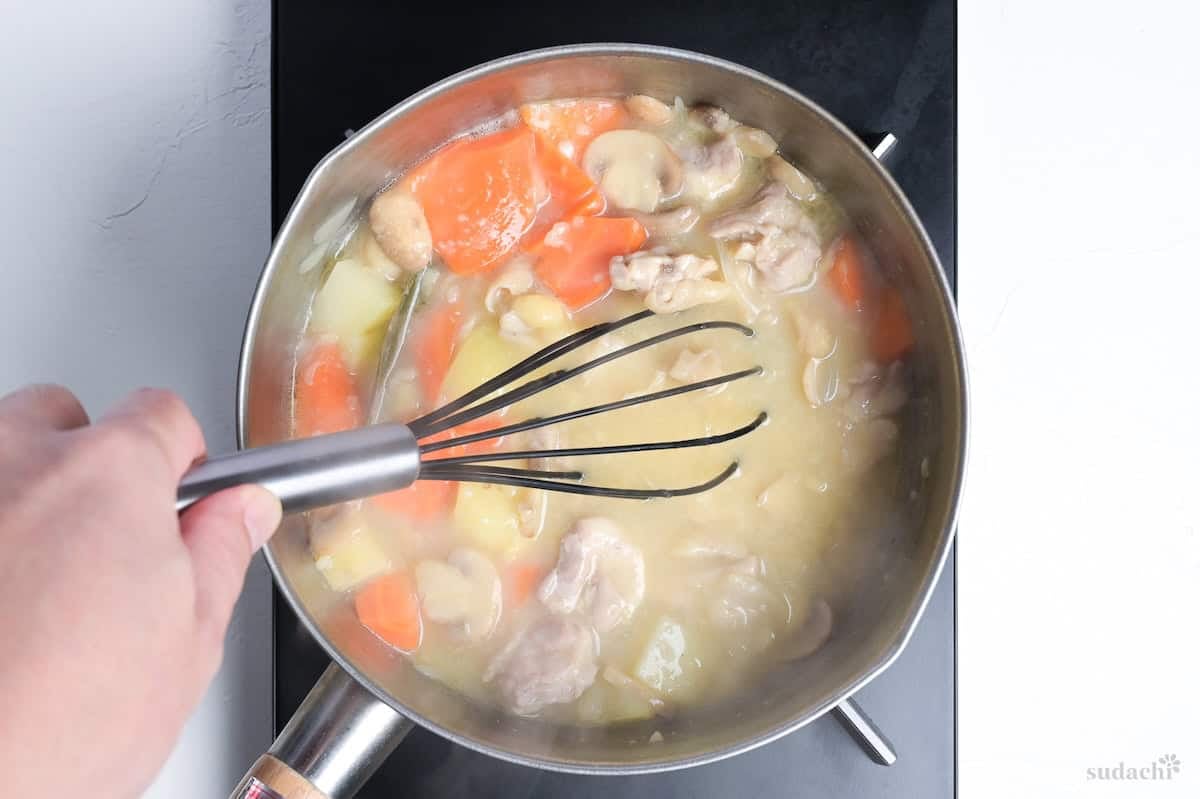 whisking roux into chicken cream stew